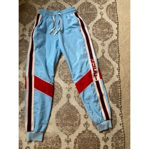 Fake Gucci blue track pants.